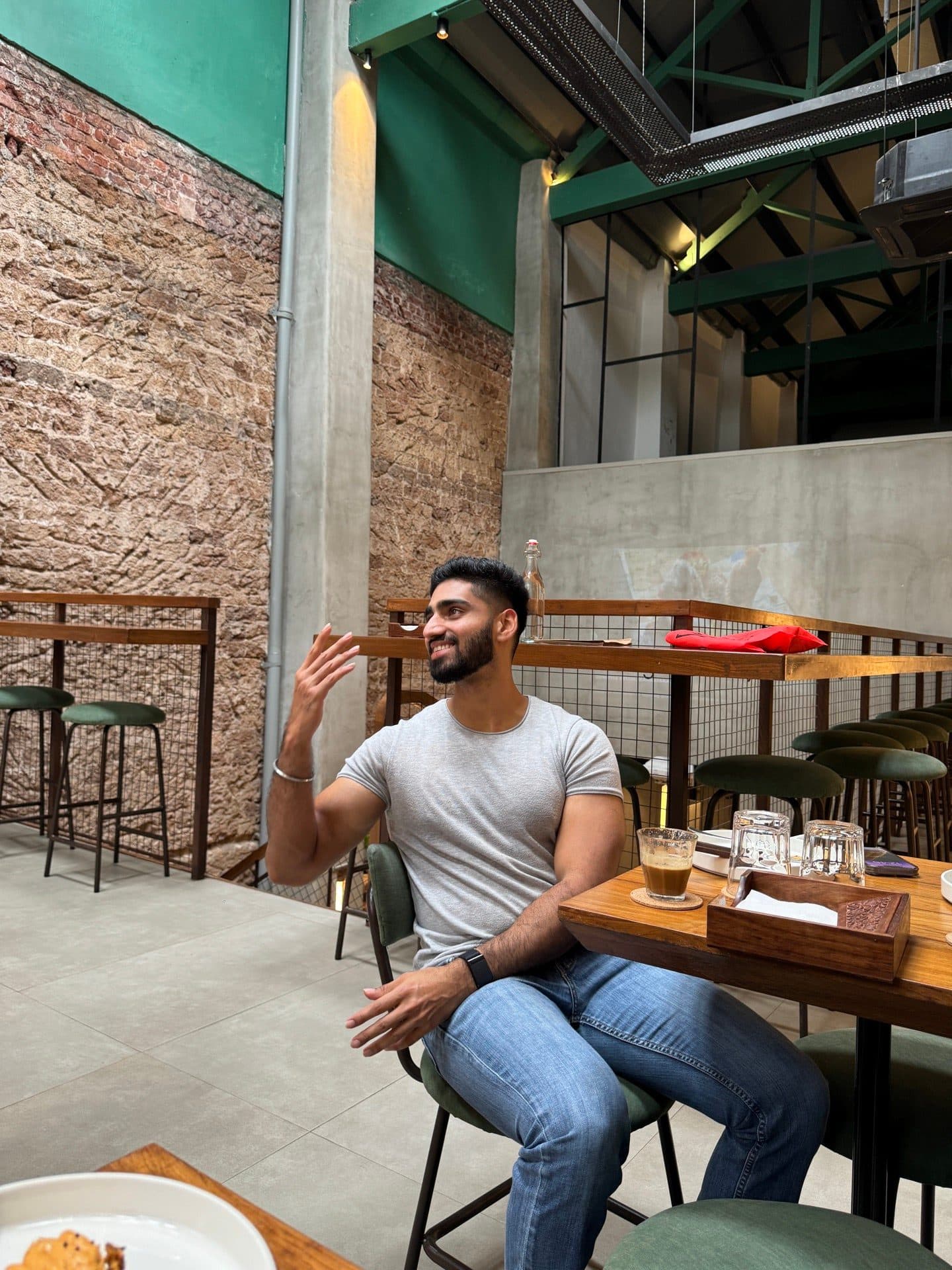 A guest relaxing between tastings in a converted mill cafe